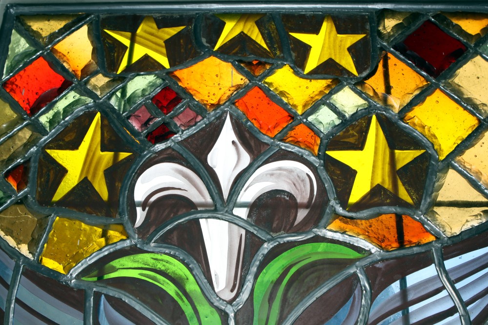 Close-up detail of stained glass showing lead lines and glass craftsmanship